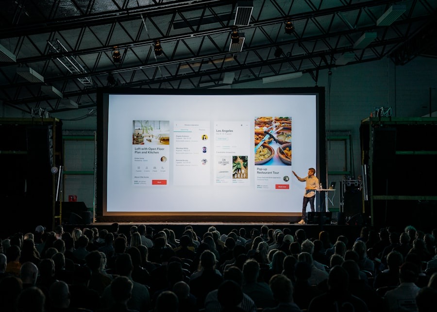 Speaker on a corporate event stage with full production lighting
