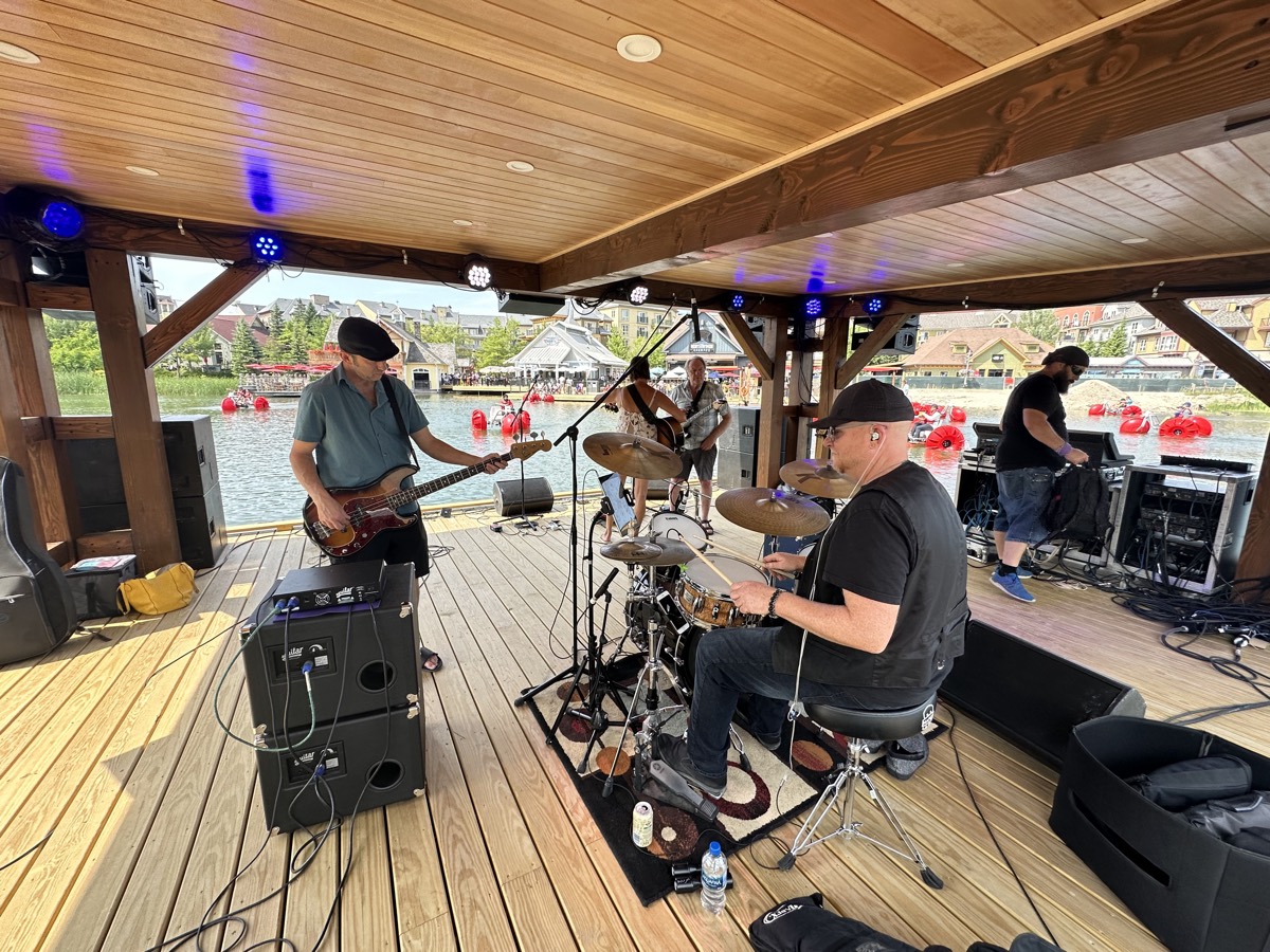 Karla Crawford Music performing at a lakeside resort stage